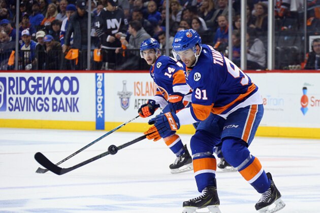 NEW YORK, NY - APRIL 24:  John Tavares #91 of the New York Islanders skates against the Florida Panthers in Game Six of the Eastern Conference First Round during the 2016 NHL Stanley Cup Playoffs at the Barclays Center on April 24, 2016 in the Brooklyn borough of New York City. The Islanders won the game 2-1 in double overtime to win the series four games to two.  (Photo by Bruce Bennett/Getty Images)