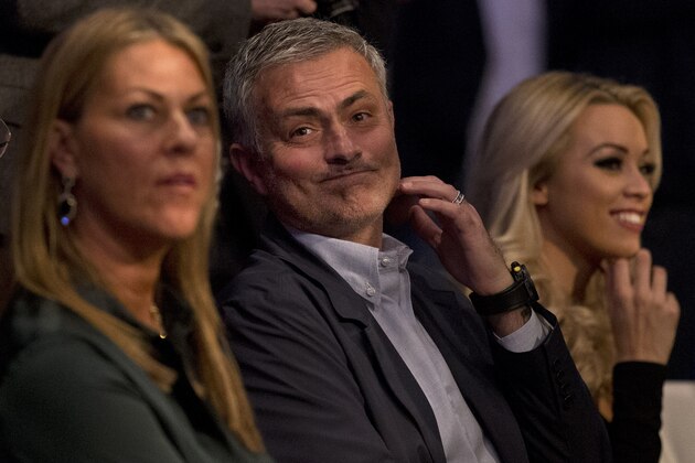 Former Chelsea football team manager Jose Mourinho waits for the start of the IBF heavyweight title bout between British boxer Anthony Joshua and US boxer Charles Martin at the O2 Arena in London, Saturday, April 9, 2016.(AP Photo/Matt Dunham)