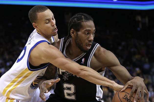 Golden State Warriors' Stephen Curry, left, guards San Antonio Spurs' Kawhi Leonard (2) during the second half of an NBA basketball game, Thursday, Dec. 19, 2013, in Oakland, Calif. (AP Photo/Ben Margot)