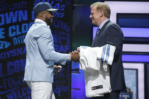 Ohio State’s Ezekiel Elliott shakes hands with NFL commissioner Roger Goodell after being selected by the Dallas Cowboys as fourth pick in the first round of the 2016 NFL football draft, Thursday, April 28, 2016, in Chicago. (AP Photo/Charles Rex Arbogast)
