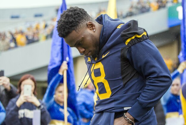 Nov 28, 2015; Morgantown, WV, USA; West Virginia Mountaineers safety Karl Joseph (8) is honored on senior day before their game against the Iowa State Cyclones at Milan Puskar Stadium. Mandatory Credit: Ben Queen-USA TODAY Sports