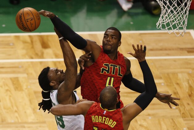 Apr 28, 2016; Boston, MA, USA; Boston Celtics forward Jae Crowder (99) shoots the ball against Atlanta Hawks forward Paul Millsap (4) and center Al Horford (15) during the first half in game six of the first round of the NBA Playoffs at TD Garden. Mandatory Credit: Mark L. Baer-USA TODAY Sports