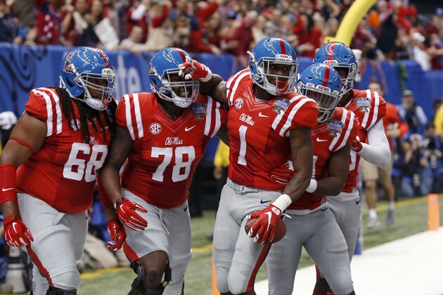 Mississippi wide receiver Laquon Treadwell (1) celebrates his touchdown reception with teammates in the first half of the Sugar Bowl college football game against Oklahoma State in New Orleans, Friday, Jan. 1, 2016. (AP Photo/Bill Feig)