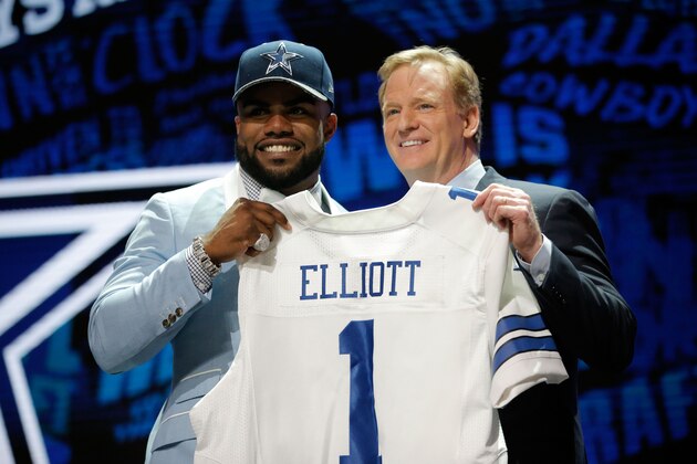 CHICAGO, IL - APRIL 28:  (L-R) Ezekiel Elliott of Ohio State holds up a jersey with NFL Commissioner Roger Goodell after being picked #4 overall by the Dallas Cowboys during the first round of the 2016 NFL Draft at the Auditorium Theatre of Roosevelt University on April 28, 2016 in Chicago, Illinois.  (Photo by Jon Durr/Getty Images)