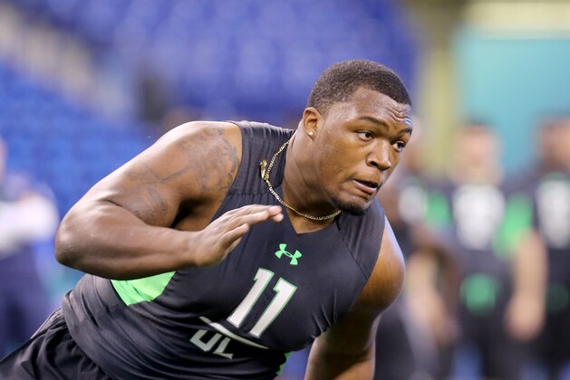 UCLA defensive lineman Kenny Clark performs a drill at the NFL football scouting combine Sunday, Feb. 28, 2016, in Indianapolis. (AP Photo/Gregory Payan)