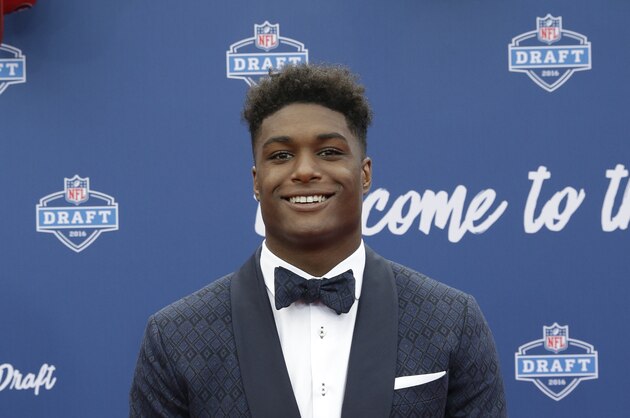 UCLA’s Myles Jack poses for photos upon arriving for the first round of the 2016 NFL football draft at the Auditorium Theater of Roosevelt University, Thursday, April 28, 2016, in Chicago. (AP Photo/Nam Y. Huh)