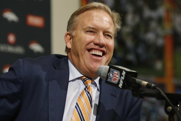 John Elway, general manager of the Denver Broncos, smiles as he takes questions during a news conference at the team's headquarters in Englewood, Colo., after the Broncos selected Memphis quarterback Paxton Lynch in the first round of the NFL football draft ,Thursday, April 28, 2016. (AP Photo/David Zalubowski)