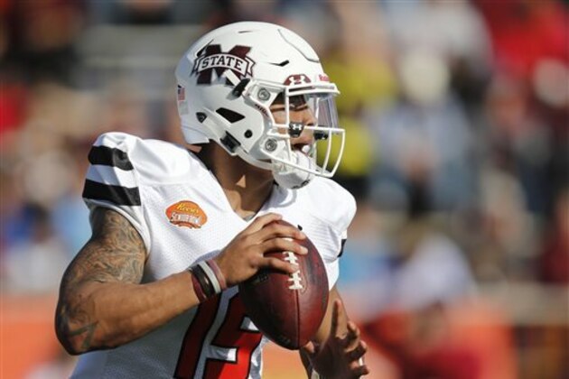 FILE - In this Jan. 30, 2016 file photo, South Team quarterback Dak Prescott, of Mississippi State, looks to pass during the first half of the Senior Bowl NCAA college football game, in Mobile, Ala. Prescott and about 15 other Mississippi State players worked out for scouts from 30 NFL teams on Thursday afternoon, March 10, 2016, at the on-campus pro day. The 6-foot-2, 226-pound quarterback was one of the main attractions, going through passing drills with receivers. (AP Photo/Brynn Anderson, File)