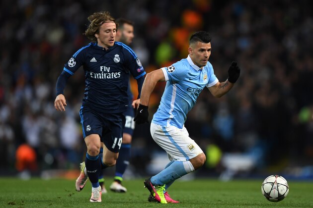 MANCHESTER, ENGLAND - APRIL 26:  Sergio Aguero of Manchester City holds off the challenge from Luka Modric of Real Madrid CF  during the UEFA Champions League Semi Final first leg match between Manchester City FC and Real Madrid at the Etihad Stadium on April 26, 2016 in Manchester, United Kingdom.  (Photo by Shaun Botterill/Getty Images)