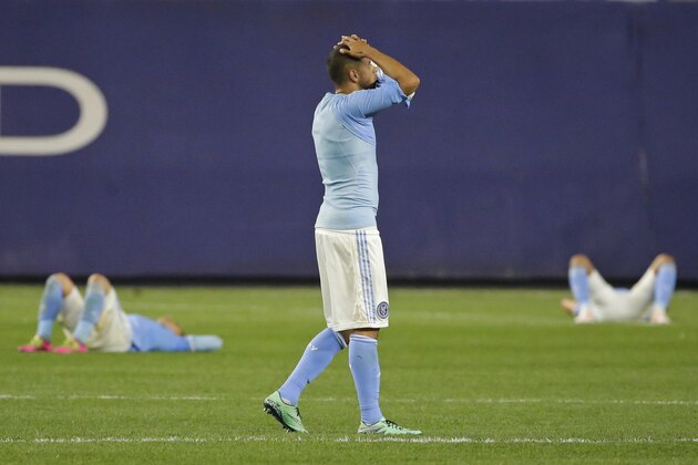 New York City FC's Jason Hernandez, center, reacts with teammates after an MLS soccer game against the Montreal Impact, Wednesday, April 27, 2016, at Yankee Stadium in New York. The game ended in a 1-1 tie. (AP Photo/Frank Franklin II)