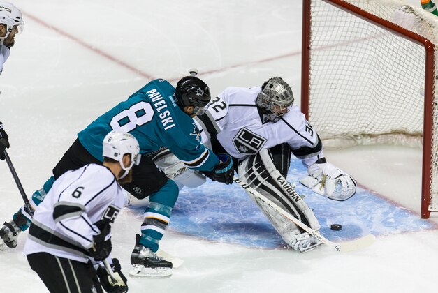 Apr 20, 2016; San Jose, CA, USA; Los Angeles Kings goalie Jonathan Quick (32) deflects a shot by San Jose Sharks center Joe Pavelski (8) in the second period of game four of the first round of the 2016 Stanley Cup Playoffs at SAP Center at San Jose. Mandatory Credit: John Hefti-USA TODAY Sports