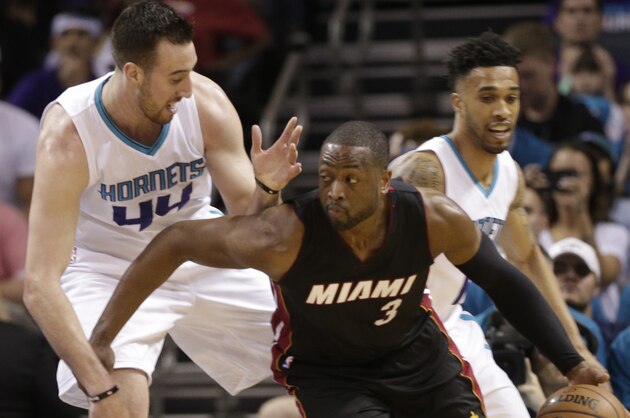 Miami Heat's Dwyane Wade (3) drives against Charlotte Hornets' Frank Kaminsky III (44) during the first half in Game 4 of an NBA basketball playoffs first-round series in Charlotte, N.C., Monday, April 25, 2016. (AP Photo/Chuck Burton)