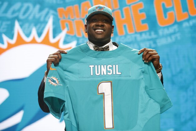 Apr 28, 2016; Chicago, IL, USA; Laremy Tunsil (Mississippi) is selected by the Miami Dolphins as the number thirteen overall pick in the first round of the 2016 NFL Draft at Auditorium Theatre. Mandatory Credit: Kamil Krzaczynski-USA TODAY Sports