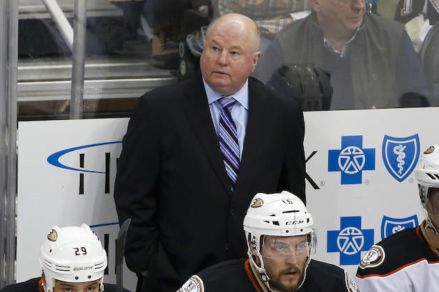 Anaheim Ducks head coach Bruce Boudreau stands behind his bench during an NHL hockey game against the Pittsburgh Penguins in Pittsburgh, Monday, Feb. 8, 2016. The Penguins won 6-2. (AP Photo/Gene J. Puskar)