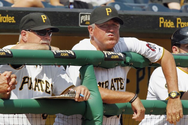 Pittsburgh Pirates manager Clint Hurdle, right, and pitching coach Ray Searage stand in the dugout during the eighth inning of a baseball game against the San Diego Padres in Pittsburgh, Sunday, Aug. 7, 2011. The Padres won 7-3 (AP Photo/Gene J. Puskar)