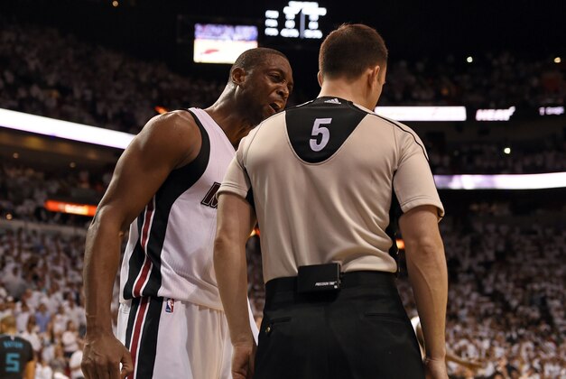 Apr 27, 2016; Miami, FL, USA; Miami Heat guard Dwyane Wade (left) yells at referee Kane Fitzgerald (right) during the second half in game five of the first round of the NBA Playoffs against the Charlotte Hornets at American Airlines Arena. Mandatory Credit: Steve Mitchell-USA TODAY Sports
