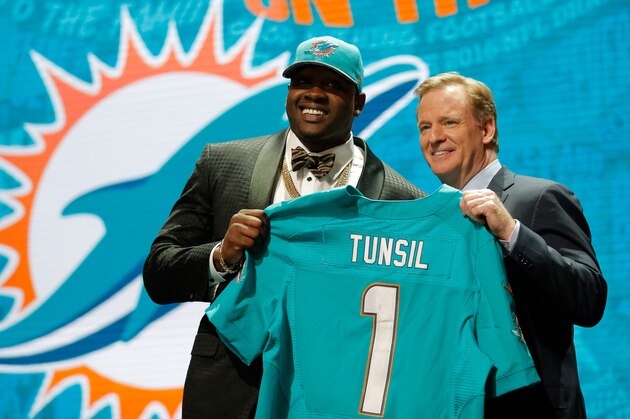 CHICAGO, IL - APRIL 28:  (L-R) Laremy Tunsil of Ole Miss holds up a jersey with NFL Commissioner Roger Goodell after being picked #13 overall by the Miami Dolphins during the first round of the 2016 NFL Draft at the Auditorium Theatre of Roosevelt University on April 28, 2016 in Chicago, Illinois.  (Photo by Jon Durr/Getty Images)