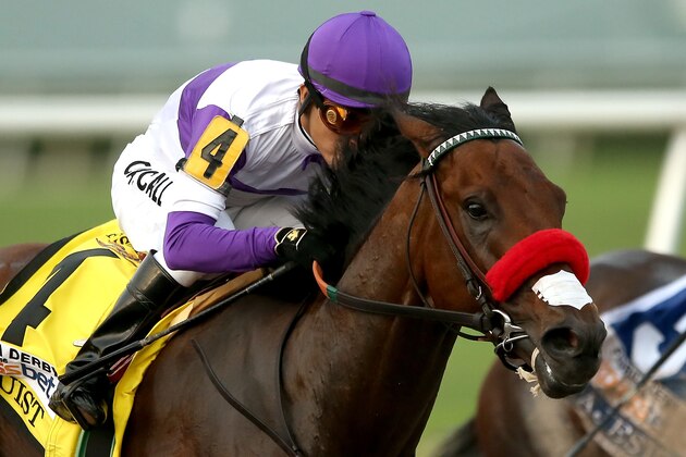HALLANDALE, FL - APRIL 02:  Nyquist #4, riden by Mario Gutuerrez, comes out of turn four during the 2016 Florida Derby at Gulfstream Park April 2, 2016 in Hallandale, Florida.  (Photo by Matthew Stockman/Getty Images)