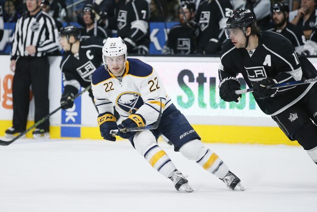 Buffalo Sabres left wing Johan Larsson, left, skates next to Los Angeles Kings center Anze Kopitar, right, during the third period of an NHL hockey game, Saturday, Feb. 27, 2016, in Los Angeles. (AP Photo/Danny Moloshok)