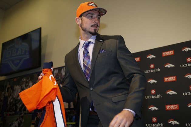 Denver Broncos first-round selection in the NFL football draft, quarterback Paxton Lynch from Memphis, is introduced Friday, April 29, 2016, in the team's headquarters in Englewood, Colo. (AP Photo/David Zalubowski)