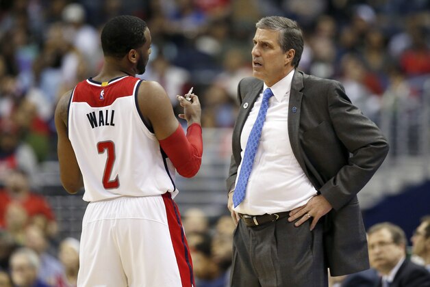 Washington Wizards guard John Wall (2) and head coach Randy Wittman talk during the second half of an NBA basketball game against the Chicago Bulls Wednesday, March 16, 2016, in Washington. (AP Photo/Alex Brandon)