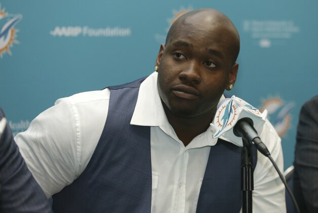 Former Mississippi offensive lineman and top Miami Dolphins draft pick Laremy Tunsil, listens during a news conference, Friday, April 29, 2016 in Davie, Fla. Tunsil was selected 13th overall in the NFL draft Thursday night. (AP Photo/Lynne Sladky)