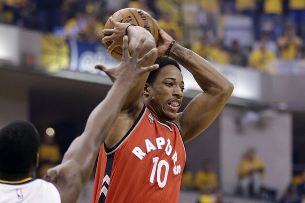 Toronto Raptors' DeMar DeRozan (10) passes against Indiana Pacers' Ian Mahinmi (28) during the first half of Game 6 of an NBA first-round playoff basketball series Friday, April 29, 2016, in Indianapolis. (AP Photo/Darron Cummings)