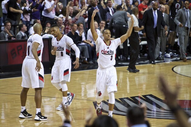 Portland Trail Blazers guard C.J. McCollum reacts after making a 3-point basket against the Los Angeles Clippers during the second half of Game 6 of an NBA basketball first-round playoff series Friday, April 29, 2016, in Portland, Ore. The Trail Blazers won 106-103. (AP Photo/Craig Mitchelldyer)