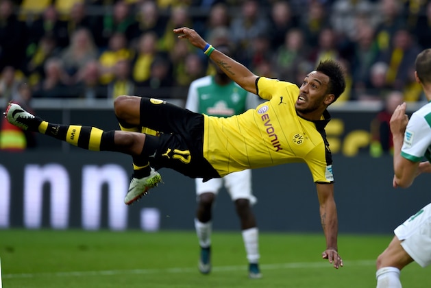 Dortmund's Gabonese striker Pierre-Emerick Aubameyang falls on the pitch as he plays the ball during the German Bundesliga first division football match between Borussia Dortmund and Werder Bremen in Dortmund, western Germany, on April 2, 2016. / AFP / PATRIK STOLLARZ / RESTRICTIONS: DURING MATCH TIME: DFL RULES TO LIMIT THE ONLINE USAGE TO 15 PICTURES PER MATCH AND FORBID IMAGE SEQUENCES TO SIMULATE VIDEO. == RESTRICTED TO EDITORIAL USE == FOR FURTHER QUERIES PLEASE CONTACT DFL DIRECTLY AT + 49 69 650050
        (Photo credit should read PATRIK STOLLARZ/AFP/Getty Images)