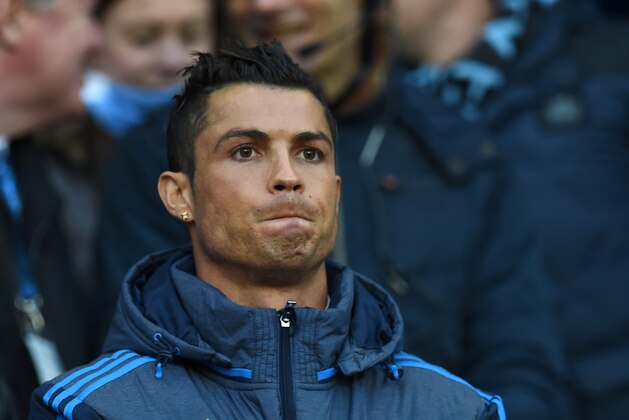 Real Madrid's Portuguese forward Cristiano Ronaldo watches from the crowd as a spectator during the UEFA Champions League semi-final first leg football match between Manchester City and Real Madrid at the Etihad Stadium in Manchester, northwest England, on April 26, 2016. / AFP / PAUL ELLIS        (Photo credit should read PAUL ELLIS/AFP/Getty Images)