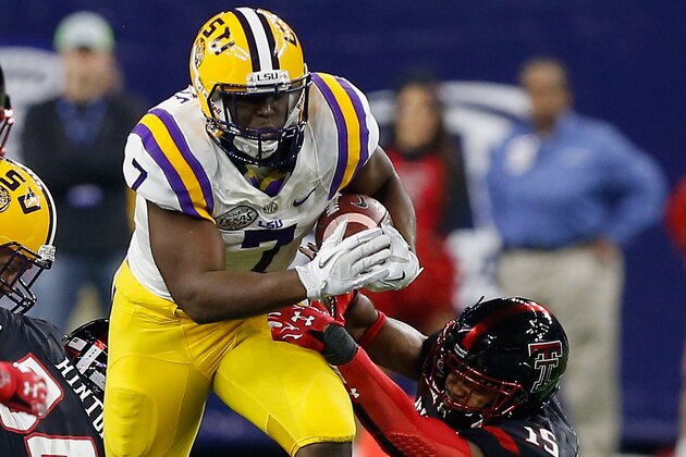 LSU running back Leonard Fournette (7) rushes past Texas Tech defensive back Keenon Ward (15) during the second half of the Texas Bowl NCAA football game Tuesday, Dec. 29, 2015, in Houston. LSU won 56-27. (AP Photo/Bob Levey)