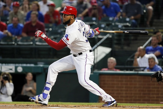 Texas Rangers' Nomar Mazara follows through on a single to left during the first inning of a baseball game against the New York Yankees on Tuesday, April 26, 2016, in Arlington, Texas. (AP Photo/Tony Gutierrez)