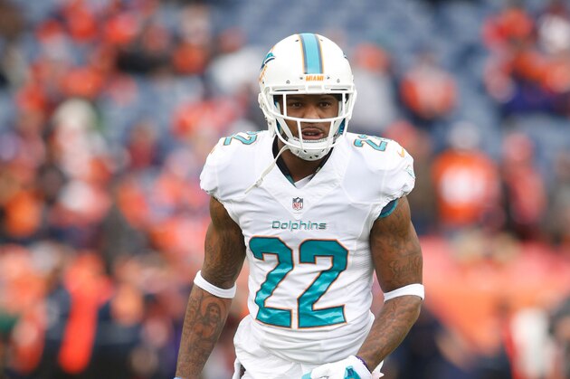 Nov 23, 2014; Denver, CO, USA; Miami Dolphins cornerback Jamar Taylor (22) before the game against the Denver Broncos at Sports Authority Field at Mile High. Mandatory Credit: Chris Humphreys-USA TODAY Sports