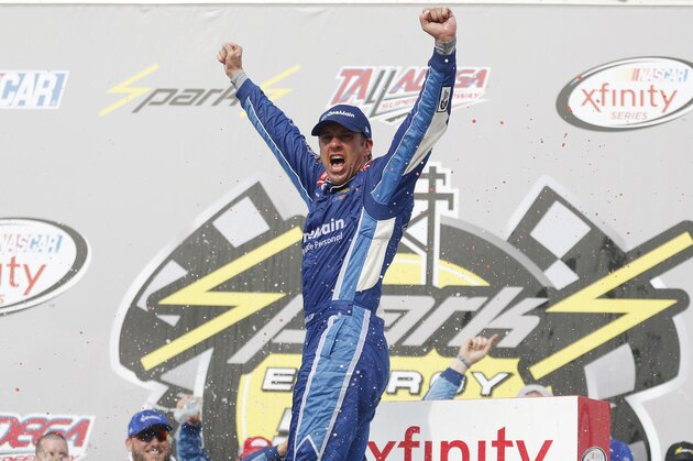 NASCAR Xfinity driver Elliott Sadler, (1) celebrates after winning the NASCAR Xfinity Series auto race at Talladega Superspeedway, Saturday, April 30, 2016, in Talladega, Ala. (AP Photo/Brynn Anderson)