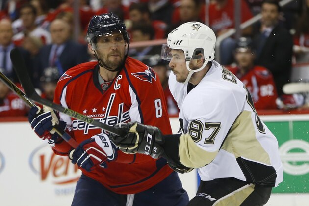 Washington Capitals left wing Alex Ovechkin (8) goes up against Pittsburgh Penguins center Sidney Crosby (87) during the second period of Game 1 in an NHL hockey Stanley Cup Eastern Conference semifinals Thursday, April 28, 2016 in Washington. (AP Photo/Pablo Martinez Monsivais)