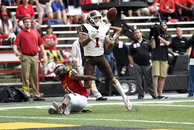 Bowling Green wide receiver Roger Lewis (1) catches a pass against Maryland defensive back Sean Davis, left, during the second half of an NCAA college football game, Saturday, Sept. 12, 2015, in College Park, Md. Lewis scored a touchdown on the play. Bowling Green won 48-27. (AP Photo/Nick Wass)