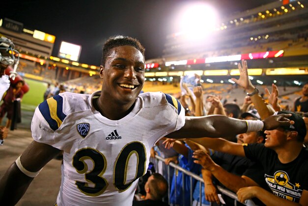Sep 25, 2014; Tempe, AZ, USA; UCLA Bruins linebacker Myles Jack (30) celebrates with fans following the game against the Arizona State Sun Devils at Sun Devil Stadium. UCLA defeated Arizona State 62-27. Mandatory Credit: Mark J. Rebilas-USA TODAY Sports