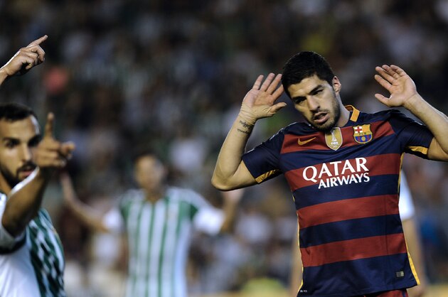 Barcelona's Uruguayan forward Luis Suarez gestures during the Spanish league football match Real Betis Balompie vs FC Barcelona at the Benito Villamarin stadium in Sevilla on April 30, 2016. / AFP / CRISTINA QUICLER        (Photo credit should read CRISTINA QUICLER/AFP/Getty Images)