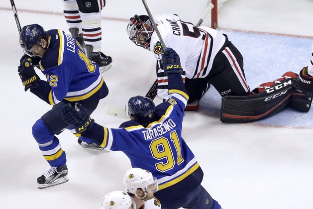 CORRECTS FINAL SCORE TO 3-2 INSTEAD OF 4-3 - St. Louis Blues' Jori Lehtera, left, of Finland, celebrates along side teammate Vladimir Tarasenko (91), of Russia, after scoring bast Chicago Blackhawks goalie Corey Crawford, right, during the first period in Game 7 of an NHL hockey first-round Stanley Cup playoff series Monday, April 25, 2016, in St. Louis. The Blues won 3-2 to take the series 4-3. (AP Photo/Jeff Roberson)