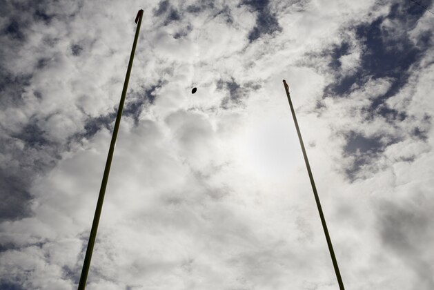 A football flies through the goalposts during warm ups before an NFL football game between the Baltimore Ravens and the Cincinnati Bengals in Baltimore, Sunday, Sept. 27, 2015. (AP Photo/Patrick Semansky)