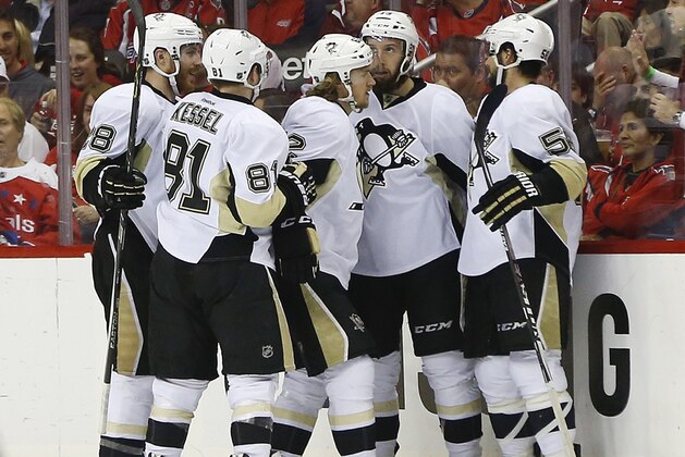Pittsburgh Penguins left wing Carl Hagelin (62) celebrates his goal against the Washington Capitals with teammates during the second period of Game 2 in an NHL hockey Stanley Cup Eastern Conference semifinals Saturday, April 30, 2016 in Washington. (AP Photo/Pablo Martinez Monsivais)