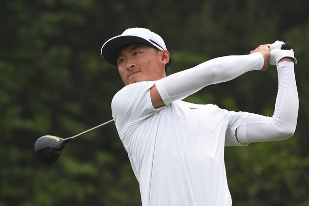 Li Haotong of China hits a shot during the final round of the Volvo China Open golf tournament in Beijing on May 1, 2016. / AFP / GREG BAKER        (Photo credit should read GREG BAKER/AFP/Getty Images)