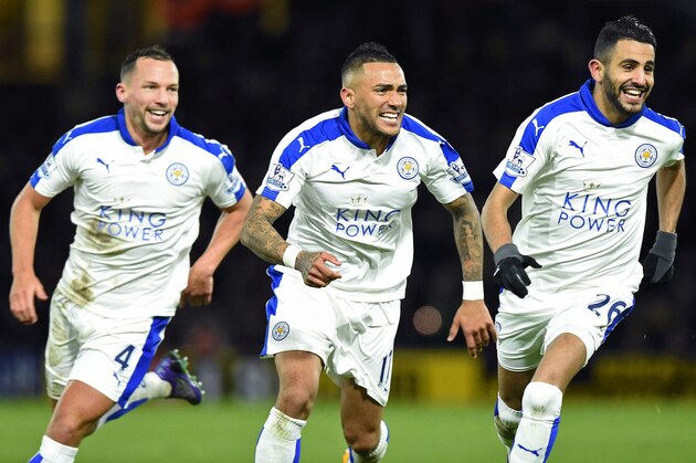 Leicester City's Algerian midfielder Riyad Mahrez (R) celebrates scoring his team's first goal with Leicester City's English midfielder Danny Drinkwater and Leicester City's Ghanaian midfielder Daniel Amartey (C) during the English Premier League football match between Watford and Leicester City at Vicarage Road Stadium in Watford, north of London on March 5, 2016. / AFP / OLLY GREENWOOD / RESTRICTED TO EDITORIAL USE. No use with unauthorized audio, video, data, fixture lists, club/league logos or 'live' services. Online in-match use limited to 75 images, no video emulation. No use in betting, games or single club/league/player publications.  /         (Photo credit should read OLLY GREENWOOD/AFP/Getty Images)