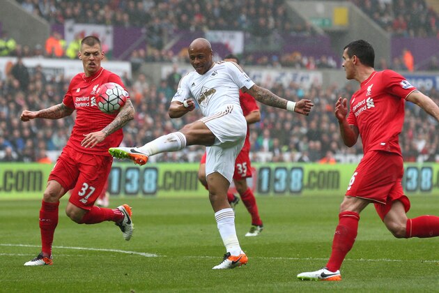 SWANSEA, WALES - MAY 01: Andre Ayew of Swansea City misses an early chance at goal watched by Martin Skrtel (L) of Liverpool during the Barclays Premier League match between Swansea City and Liverpool at The Liberty Stadium on May 1, 2016 in Swansea, Wales.  (Photo by Steve Bardens/Getty Images)