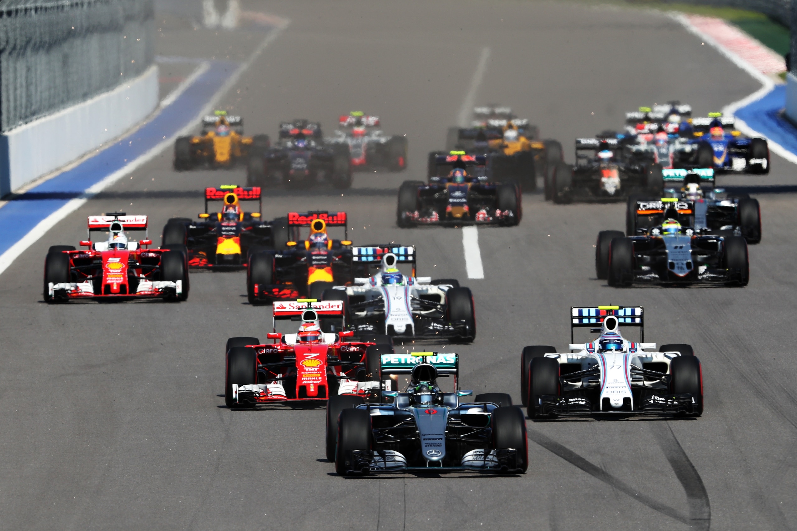 SOCHI, RUSSIA - MAY 01: Nico Rosberg of Germany driving the (6) Mercedes AMG Petronas F1 Team Mercedes F1 WO7 Mercedes PU106C Hybrid turbo leads at the start ahead of Kimi Raikkonen of Finland driving the (7) Scuderia Ferrari SF16-H Ferrari 059/5 turbo (Shell GP), Valtteri Bottas of Finland driving the (77) Williams Martini Racing Williams FW38 Mercedes PU106C Hybrid turbo and the rest of the field during the Formula One Grand Prix of Russia at Sochi Autodrom on May 1, 2016 in Sochi, Russia.  (Photo by Mark Thompson/Getty Images)