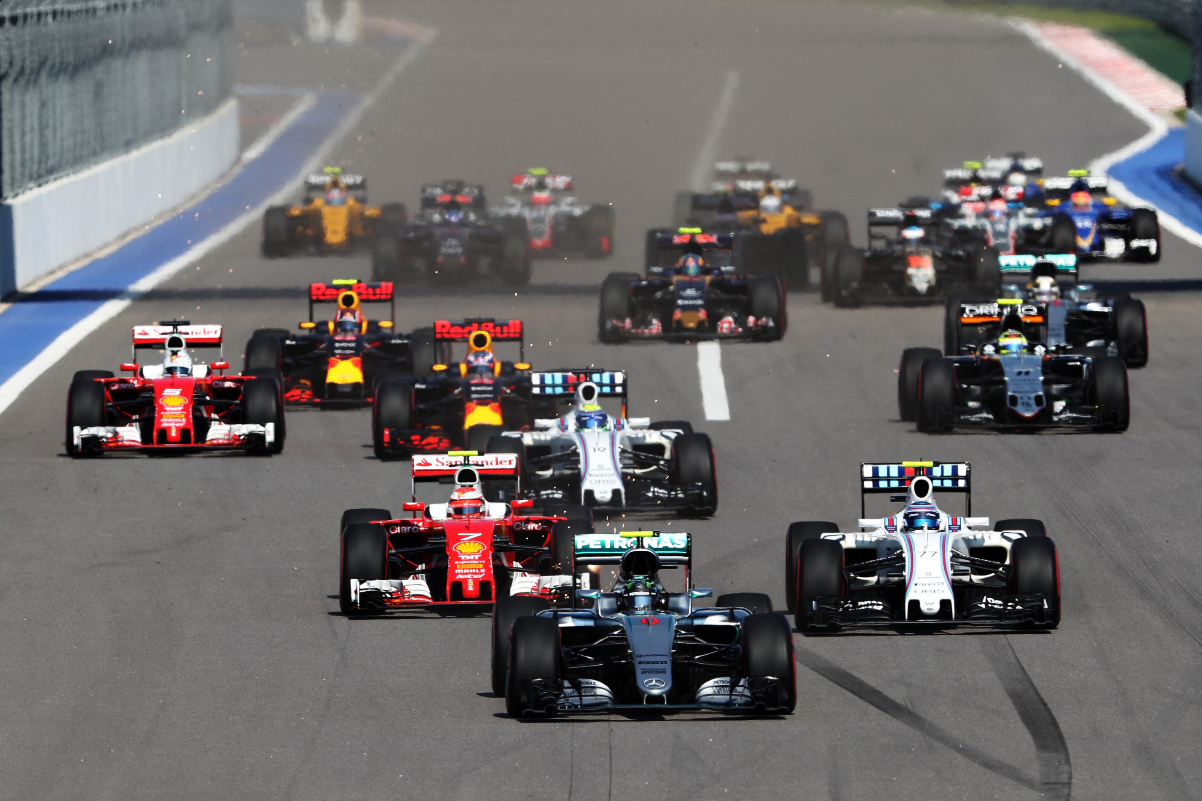 SOCHI, RUSSIA - MAY 01: Nico Rosberg of Germany driving the (6) Mercedes AMG Petronas F1 Team Mercedes F1 WO7 Mercedes PU106C Hybrid turbo leads at the start ahead of Kimi Raikkonen of Finland driving the (7) Scuderia Ferrari SF16-H Ferrari 059/5 turbo (Shell GP), Valtteri Bottas of Finland driving the (77) Williams Martini Racing Williams FW38 Mercedes PU106C Hybrid turbo and the rest of the field during the Formula One Grand Prix of Russia at Sochi Autodrom on May 1, 2016 in Sochi, Russia.  (Photo by Mark Thompson/Getty Images)