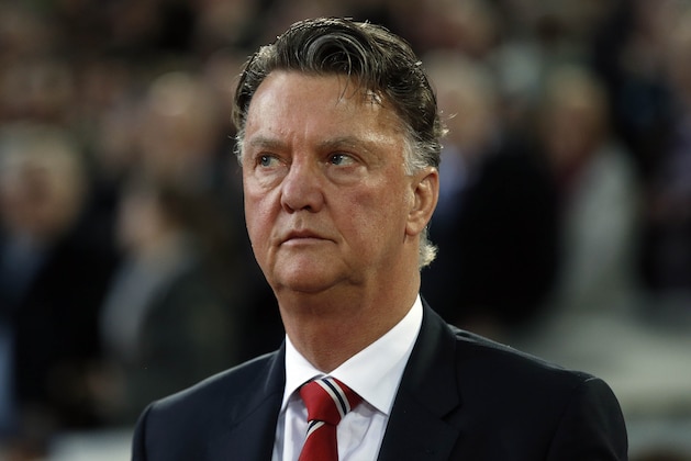 United’s manager Louis van Gaal concentrates prior to the English FA Cup quarterfinal replay soccer match between West Ham and Manchester United at Boleyn Ground stadium in London, Wednesday, April 13, 2016.(AP Photo/Alastair Grant)