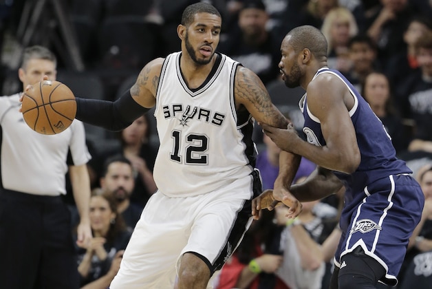 San Antonio Spurs forward LaMarcus Aldridge (12) drives around Oklahoma City Thunder forward Serge Ibaka (9) during the first half in Game 1 of a second-round NBA basketball playoff series, Saturday, April 30, 2016, in San Antonio. (AP Photo/Eric Gay)