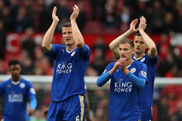 MANCHESTER, ENGLAND - MAY 01:  Marc Albrighton and Robert Huth (l) of Leicester City salute the fans at the end of the Barclays Premier League match between Manchester United and Leicester City at Old Trafford on May 1, 2016 in Manchester, United Kingdom.  (Photo by Matthew Ashton - AMA/Getty Images)