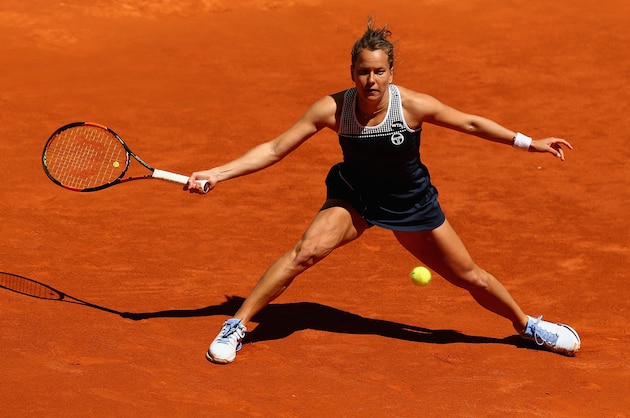 MADRID, SPAIN - MAY 01: Barbora Strycova of the Czech Republic stretches to play a forehand against Angelique Kerber of Germany in their first round match during day two of the Mutua Madrid Open tennis tournament at the Caja Magica on May 01, 2016 in Madrid,Spain (Photo by Clive Brunskill/Getty Images) MADRID, SPAIN - MAY 01: Barbora Strycova of the Czech Republic stretches to play a forehand against Angelique Kerber of Germany in their first round match during day two of the Mutua Madrid Open tennis tournament at the Caja Magica on May 01, 2016 in Madrid,Spain (Photo by Clive Brunskill/Getty Images)